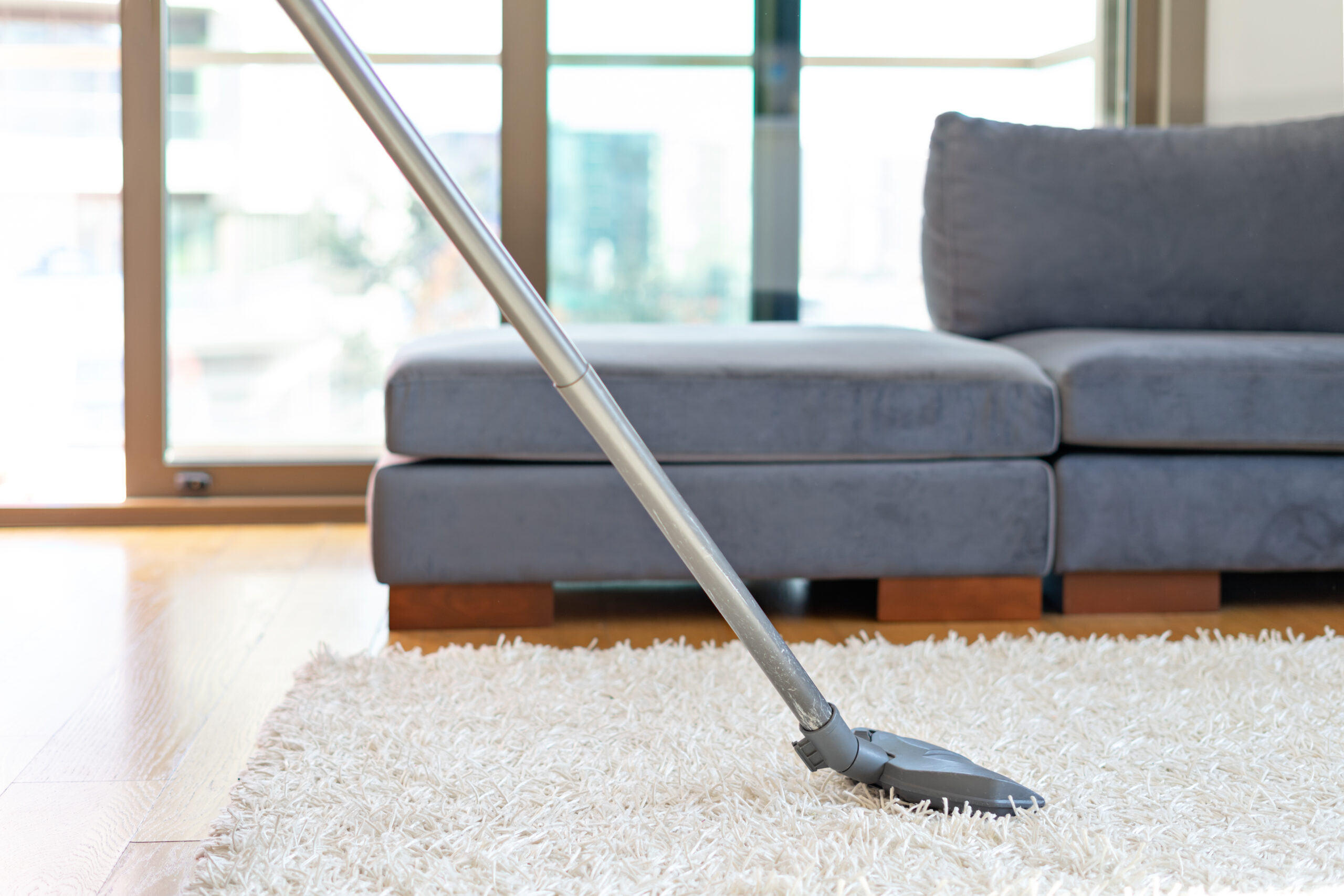 Cleaning floor and carpet with vacuum cleaner